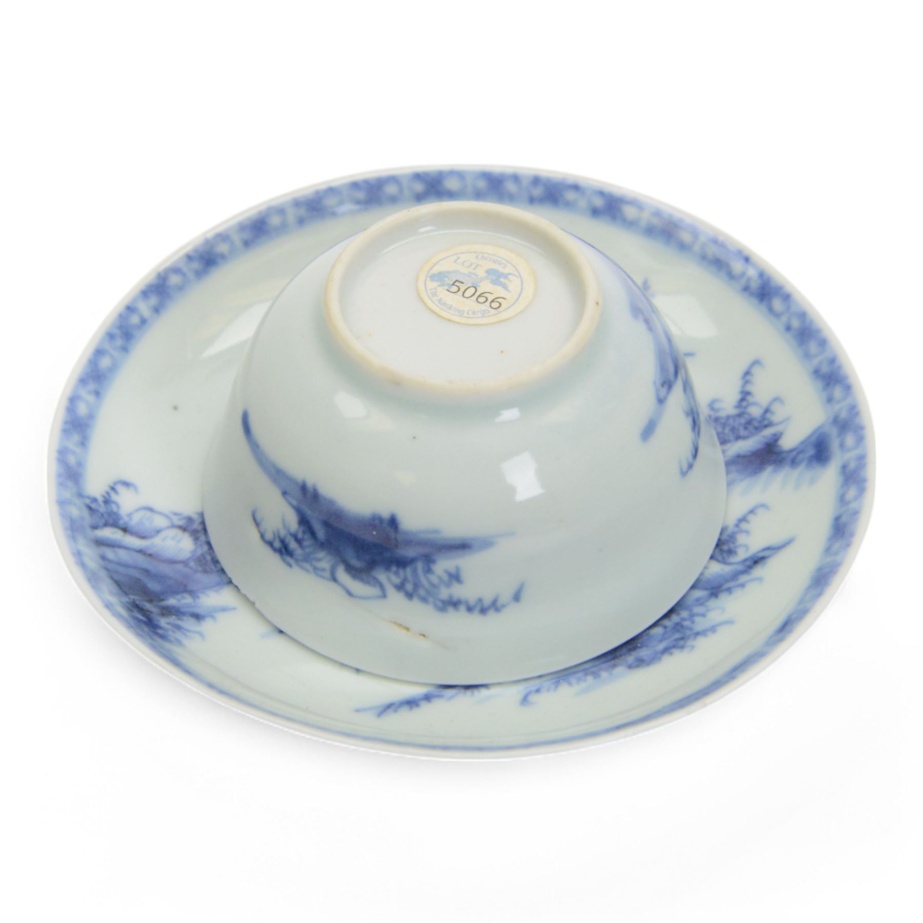 Qing Dynasty Nanking Cargo blue and white Paoda Riverscape tea bowl and saucer, with Christie's auction label underneath