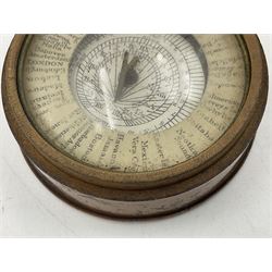 19th century pocket sundial compass pantochronometer, central sun dial pivoting with angled gnomon, within a broad enamelled band, listing world cities, paper calendar label to cover