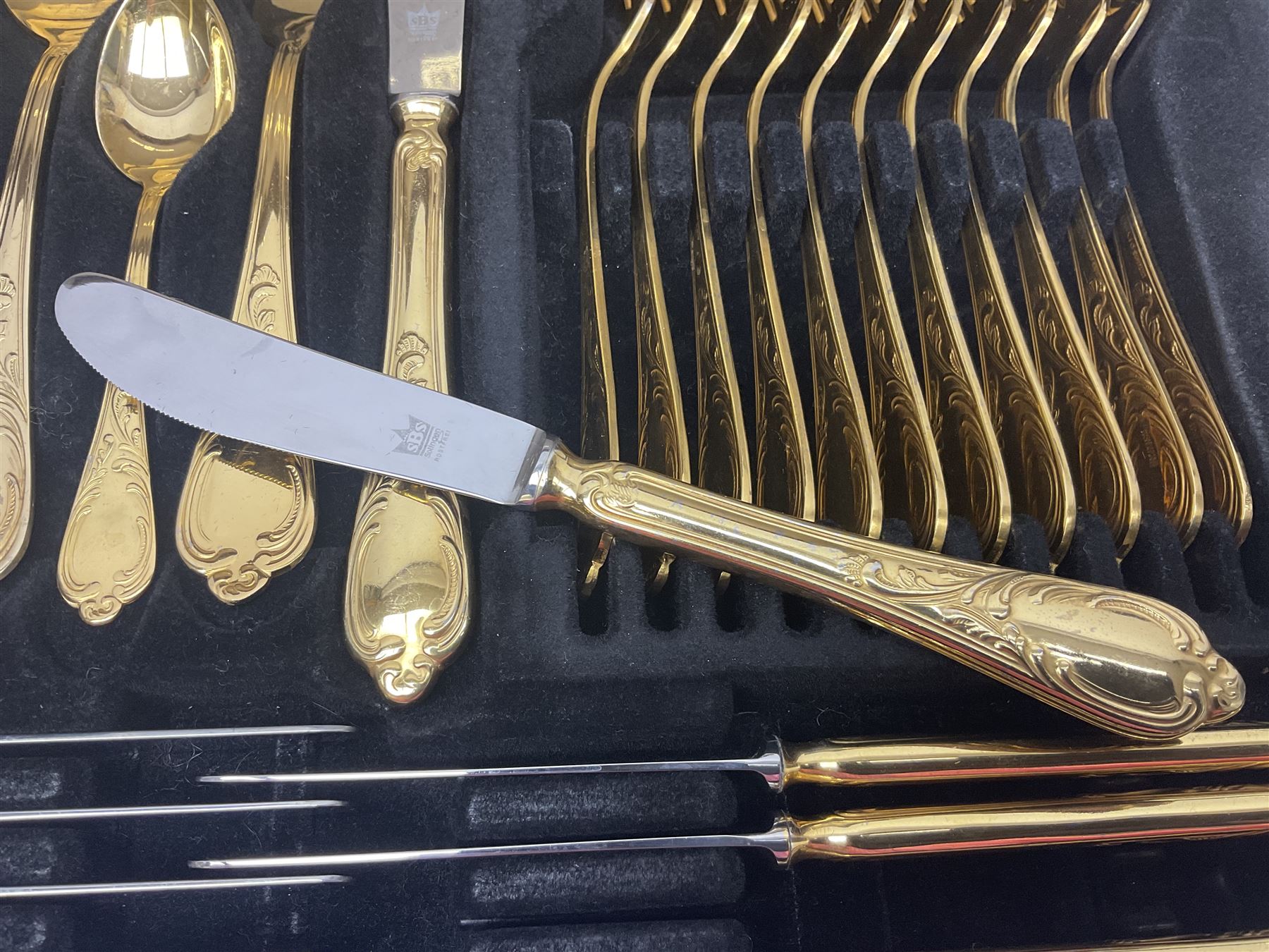 Bestecke Solingen canteen of gold plated cutlery for twelve place settings, including ladle, cake slice and serving spoons, contained within a briefcase, together with a matching set twelve of Bestecke Solingen gold plated fish knives and forks, in fitted case 