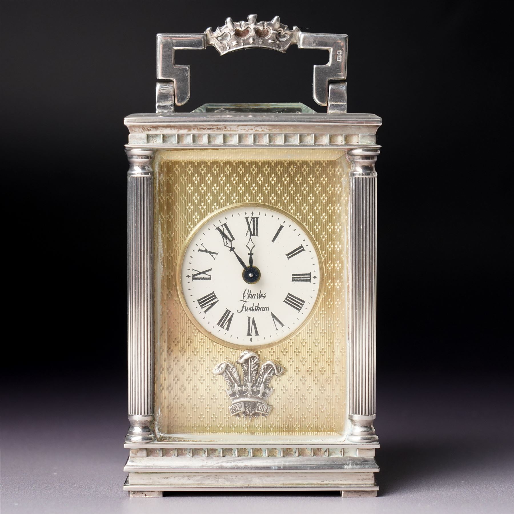 Chas Frodsham -  Miniature carriage clock with platform lever escapement commemorating the marriage of Prince Charles and Lady Diana Spencer, the white dial with an engine turned gilt surround and fleur de lis in silver case with fluted columns and bevelled glass panels H10cm  No.43/1000 London 1981 with key