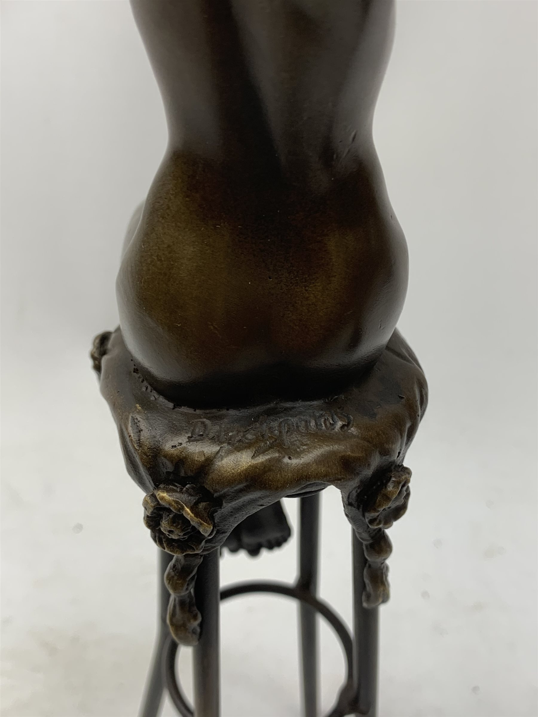 After D H Chiparus, an Art Deco style bronze modelled as a nude female figure seated upon a chair, H28cm. 