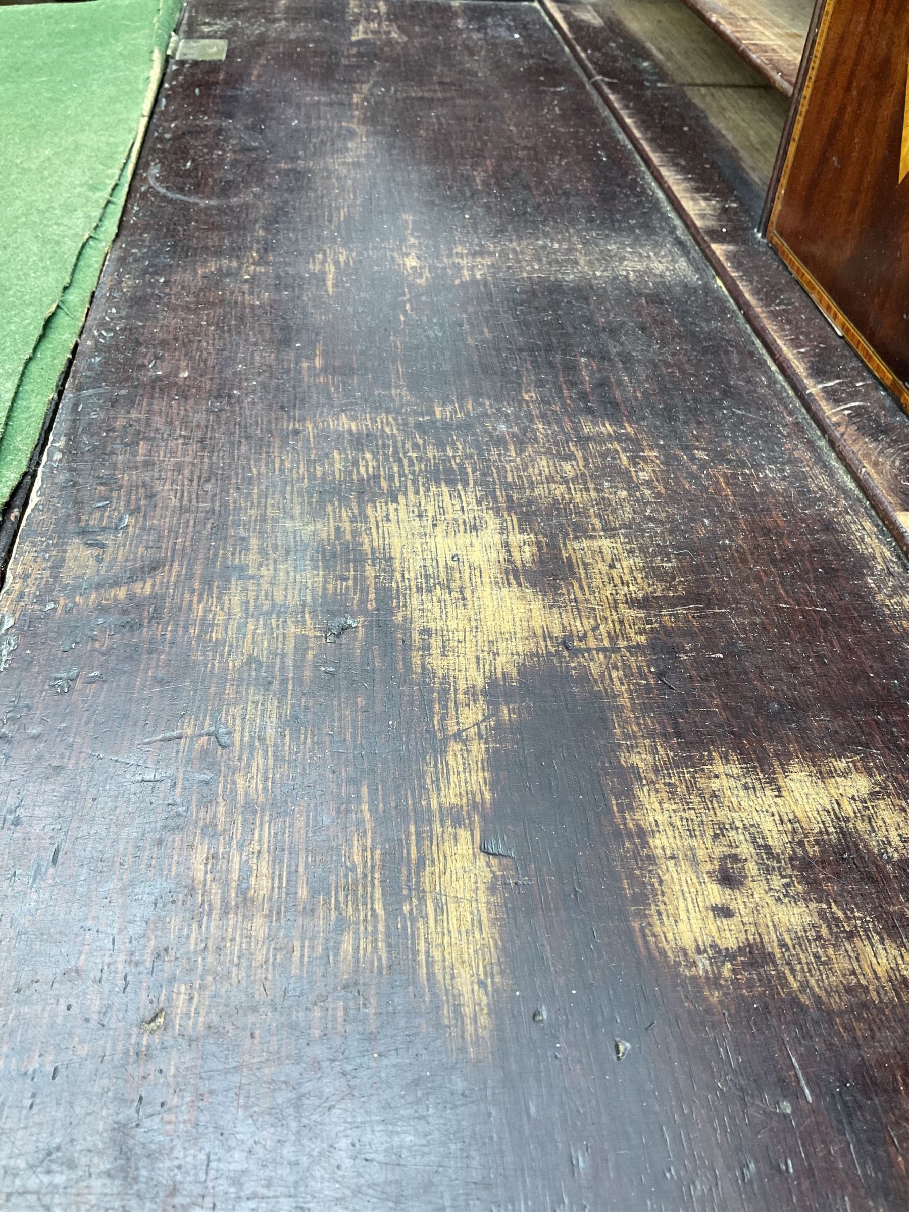 George III mahogany bureau, the conch inlaid fall front enclosing pigeon holes, shelves and central cupboard with inlaid flower motif, four graduating cock-beaded drawers below each with brass handles, lower moulded edge over shaped bracket feet