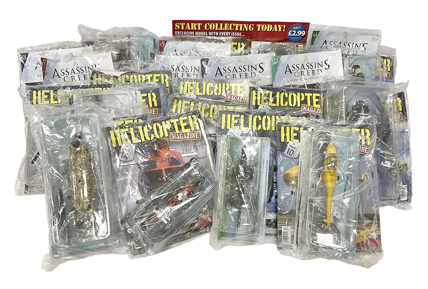 Fifteen Amer Czechoslovakia periodical issued metal models of helicopters each in unopened original packaging with copy of 'Helicopter Magazine'; together with seven unopened Hachette 'Assassin's Creed' periodical figures with magazines (22)