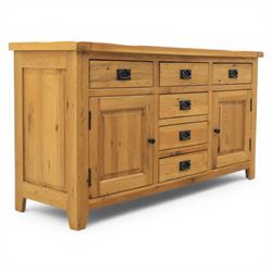 Modern light oak sideboard, fitted with six drawers and two cupboards