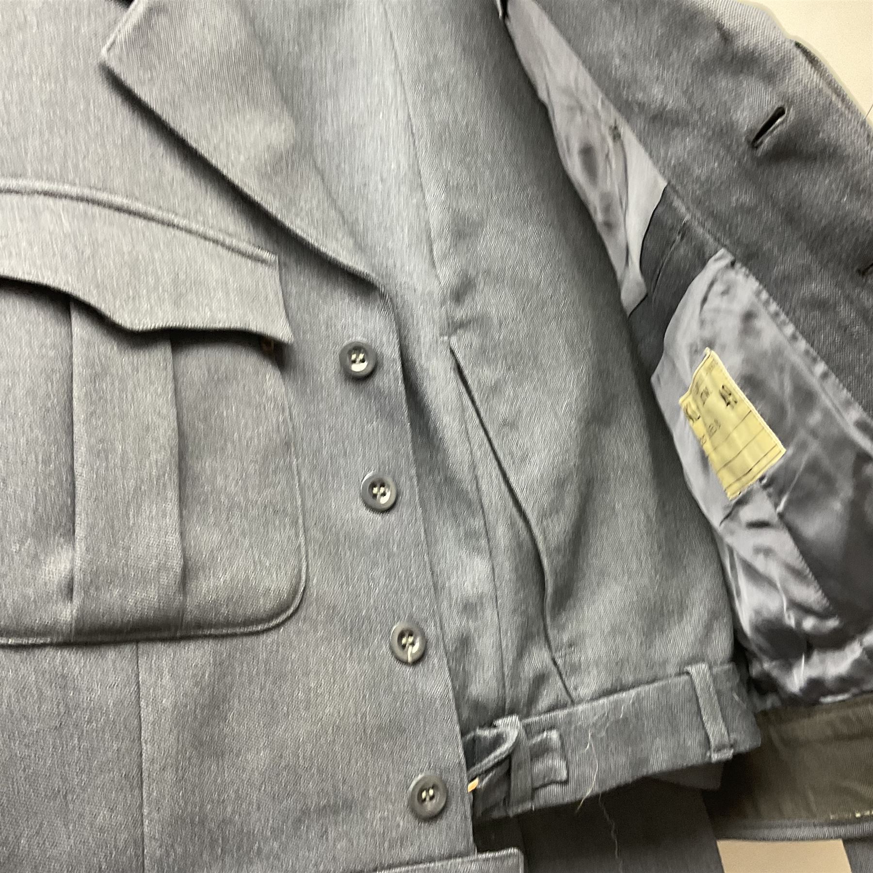 Two post-WWII British Army No.2 Dress tunics, one with Green Howards buttons; army shirt dated 1951; Royal Fleet Auxilliary jacket with trousers; three RAF/WAAF uniforms and RAF Greatcoat; and three canvas/webbing bags, two dated 1943 & 1945