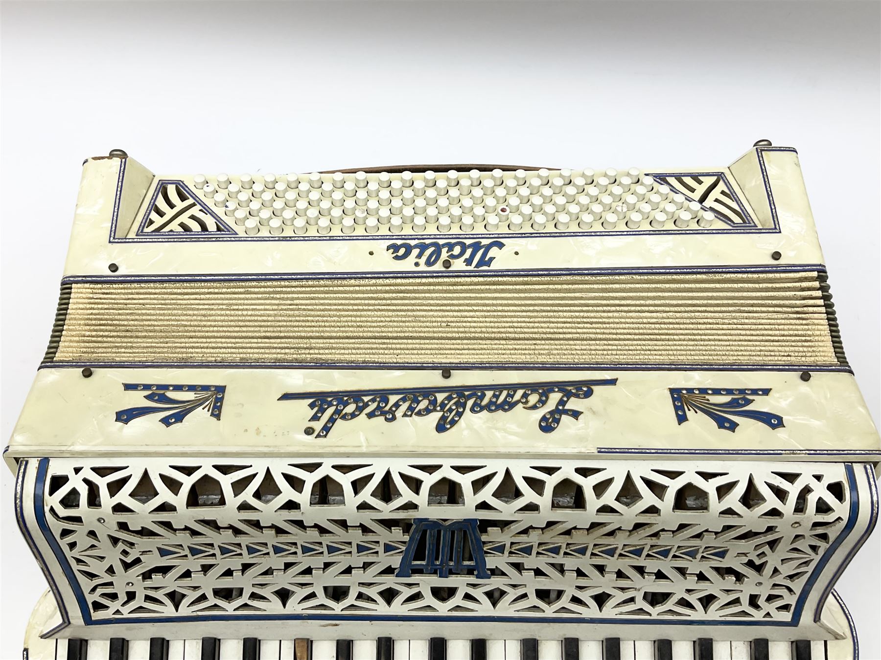 Italian Lambardi piano accordion in ivory coloured pearline case with jewelled decoration, twenty keys and one-hundred and twenty buttons L 37cm