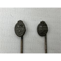 Nine WW2 German lapel pins including five Infantry Assault, Tank Assault etc 