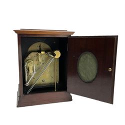 Continental early 20th century mahogany cased 8-day mantle clock, rectangular case with a flat top and fully glazed arched door to the silvered dial, separate chapter with Roman numerals, minute track and steel spade hands, subsidiary time regulation dial, with a twin train Westminster chiming movement, lever platform escapement and four gong rods. Retailed by James Ramsay, Dundee.