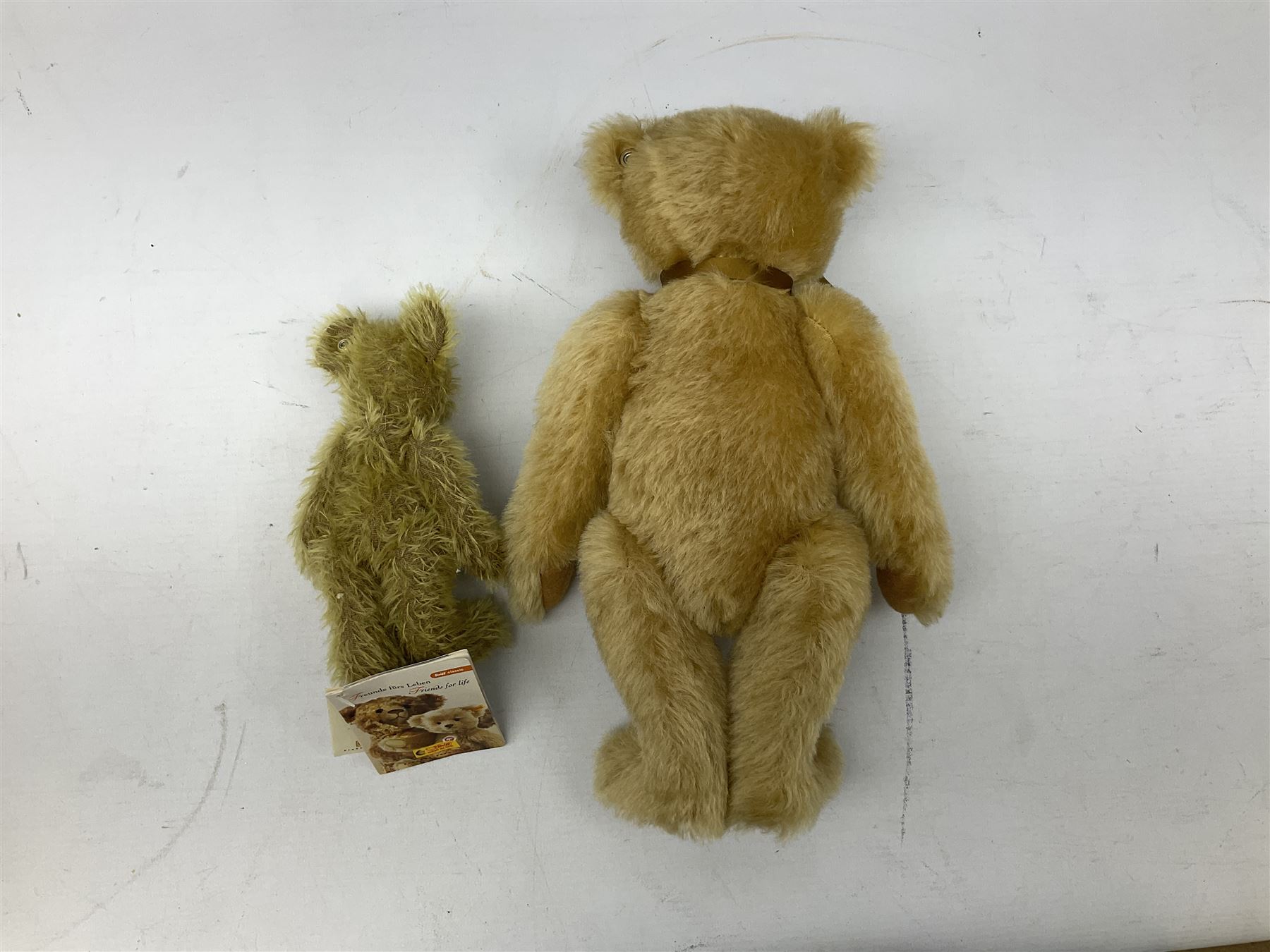Two Steiff teddy bears comprising 2006 'Bear of the Year', limited edition with original dust bag and certificate, and 'Big Foot Bear' serial no. 002939, both with tags in ear