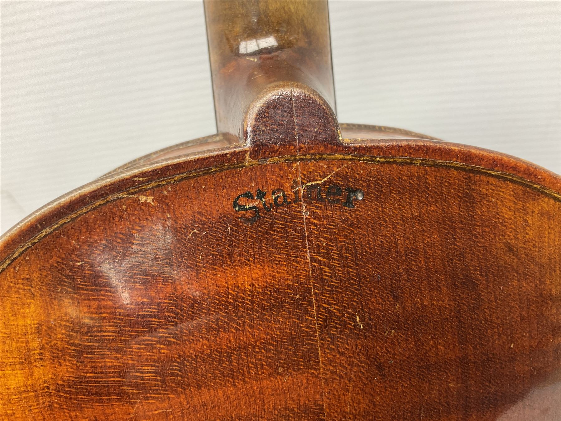 German trade violin c1900 the 36cm two-piece maple back impressed 'Stainer', maple ribs and spruce top, bears label 'Jacobis Stainer in Absam prope Oenipontum 17**' L59cm; in carrying case marked 'The Improved Dome' with bow