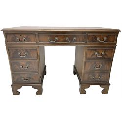 Georgian design mahogany twin pedestal desk, moulded rectangular top with leather inset, fitted with eight drawers, on bracket feet