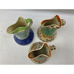 Seven Myott Son & Co hand painted jugs, all with printed mark beneath, H21cm