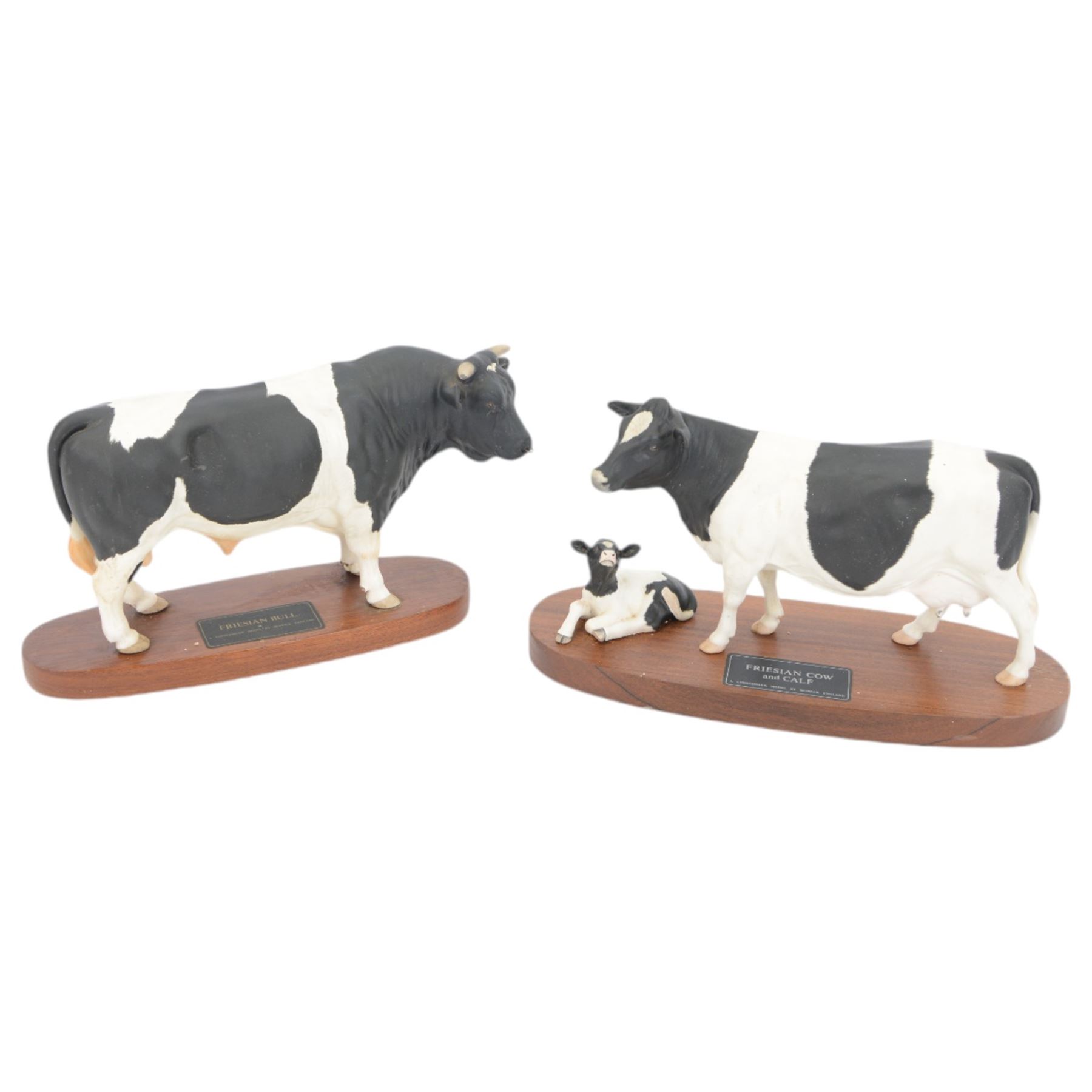 Two Beswick Connoisseur Cattle: Friesian Bull, model and Friesian Cow and Calf, both on wooden plinths, H20cm