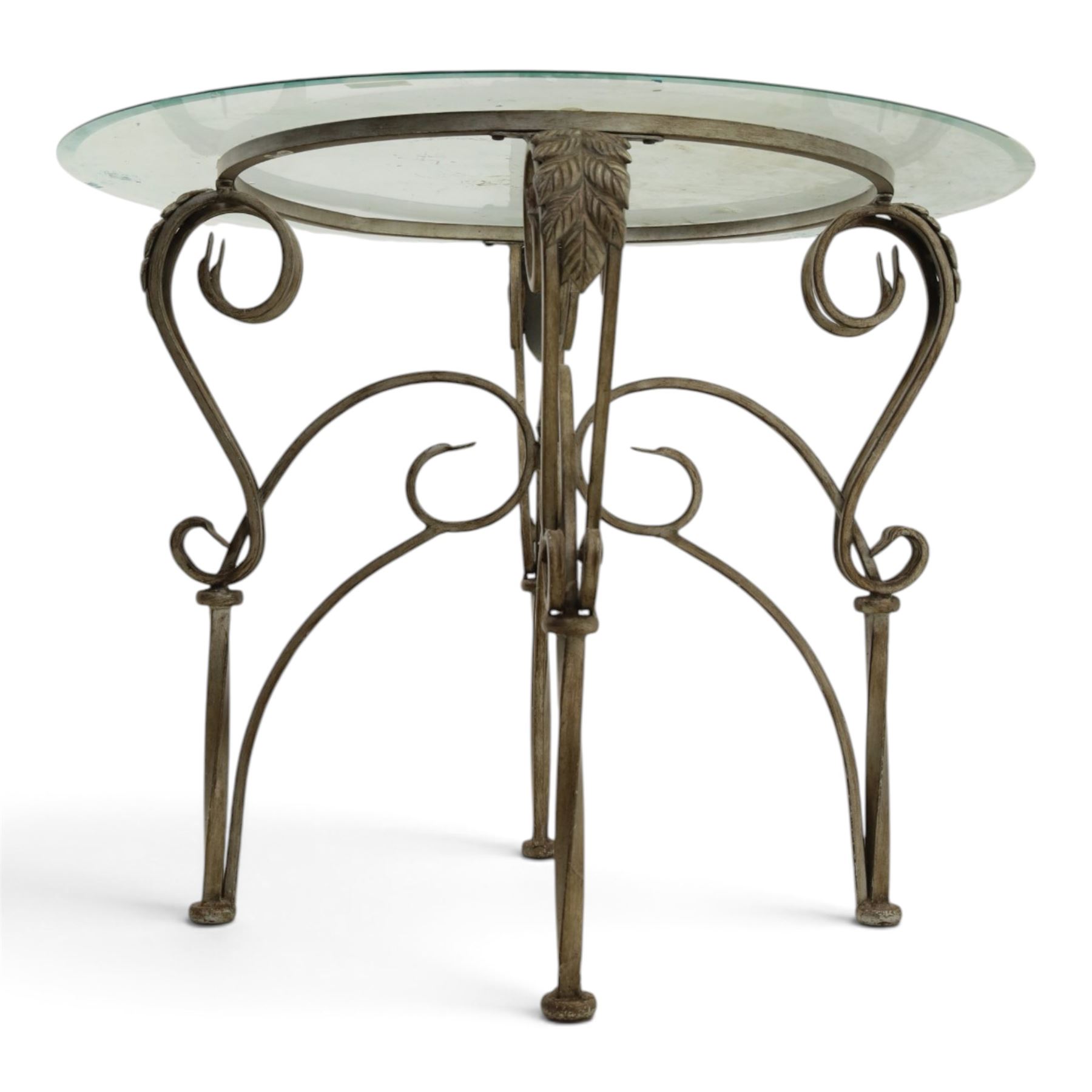 Wrought metal and glass table, with silvered foliate and scrolled design