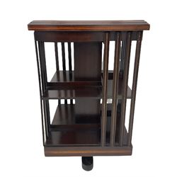 20th century mahogany revolving bookcase, inlaid centre motif, satinwood banded border