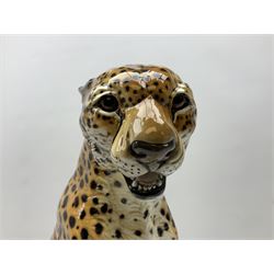 Ronzan fireside model of a cheetah, with painted mark beneath, H45cm 