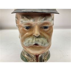 Otto Von Bismarck figural 0.5l stein, his black pickelhaube helmet with chrome spike serving as the lid, in green uniform and gilt detail throughout, pewter thumb hinge, with blue hash Musterschutz type mark, H18cm