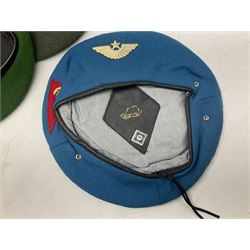 Four paratrooper berets - Russian, Italian, British and Foreign Legion; all with badges (4)