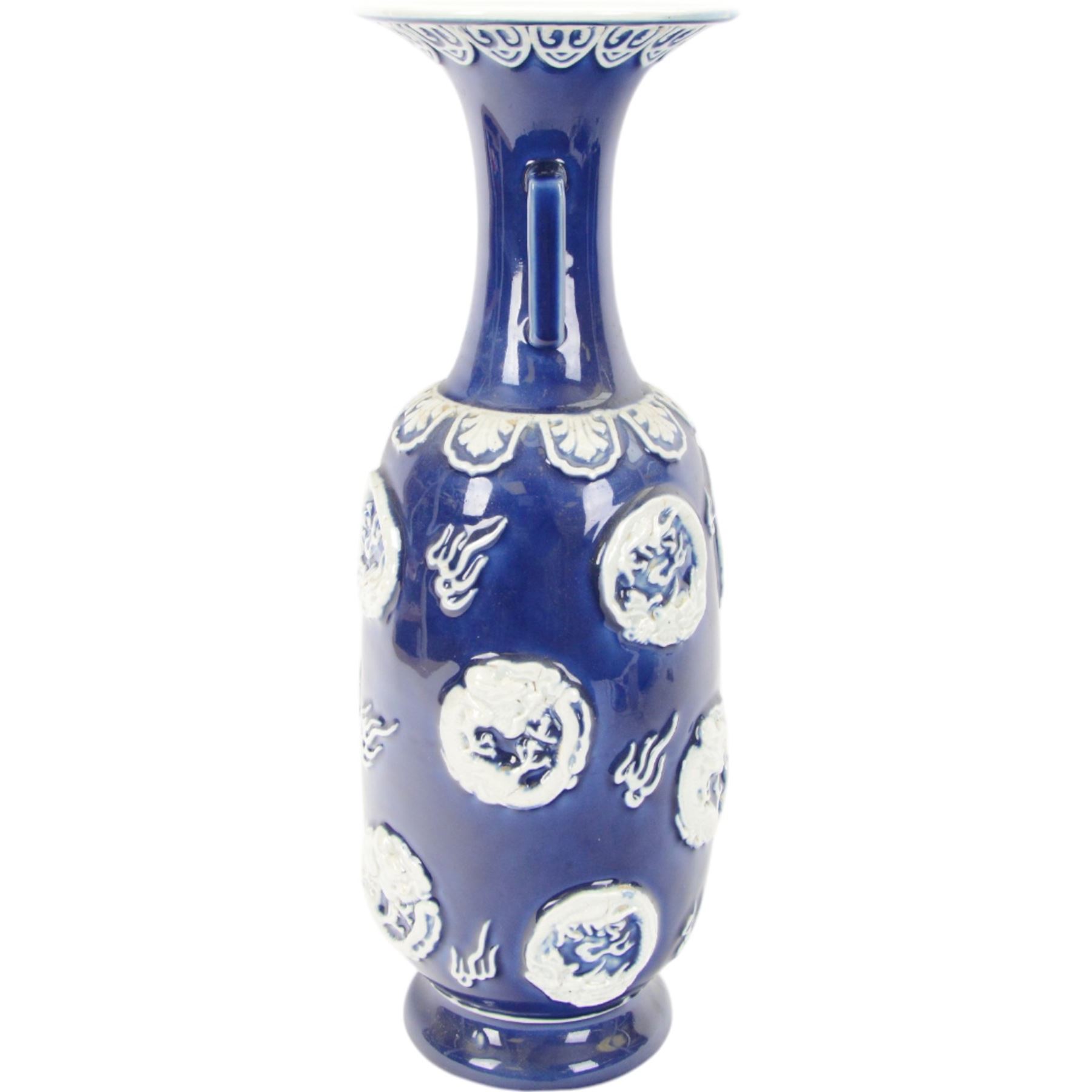 Chinses twin handled blue and white vase, decorated in relief with dragons amongst clouds upon a blue ground, H58cm 