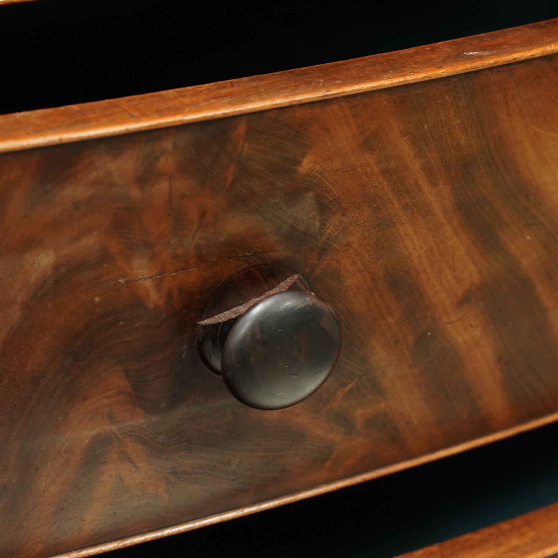 19th century mahogany chest of drawers, bow fronted form with two short over three long drawers, each veneered in matched flame mahogany, on turned feet