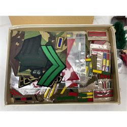 Quantity of military horse hair plumes and feather hackles, cloth stripes and regimental titles etc