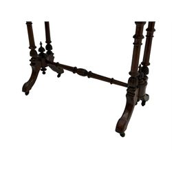 Victorian walnut stretcher table, shaped top on quadruple turned pillar supports, on splayed feet joined by turned stretcher