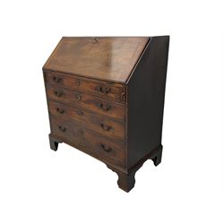 Georgian mahogany bureau, fall front enclosing well fitted interior, over four graduating drawers, on bracket feet