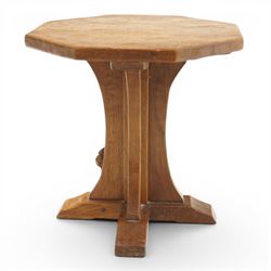Mouseman - mid-20th century adzed oak coffee table of small proportions, the octagonal  adzed top raised on cruciform base and sledge feet, carved with mouse signature, by the workshop of Robert Thompson of Kilburn 