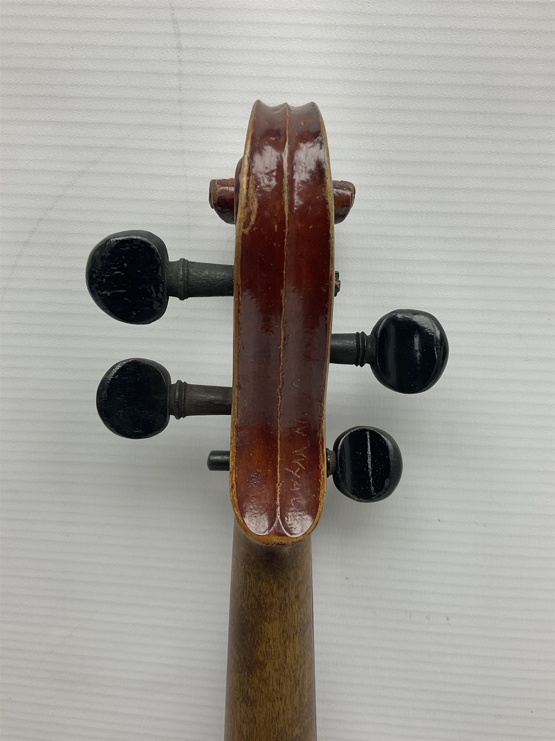 Late 19th century French three-quarter size 'Conservatory' violin with 34cm two-piece maple back and ribs and spruce top, the peg box inscribed 'Conservatory Violin Straduari', bears label 'Antonius Stradiuarius Cremonensis Faciebat Anno 1721' L55.5cm overall; in ebonised wooden 'coffin' case; and Saxony violin c1900 with 36cm two-piece maple back and ribs and spruce top; bears label 'Antonius Stradivarius Cremonensis Faciebat Anno 17**' L59cm overall; in carrying case (2)
