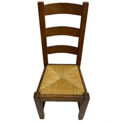 Antix French oak dining table with two leaves, two frieze drawers;, and six ladder back chairs with rush seats
