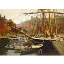 John Ernest Foster (British 1877-1968): Cobles Moored at Whitby, oil on panel signed 29cm x 40cm