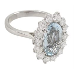 18ct white gold oval aquamarine and round brilliant cut diamond cluster ring, hallmarked, aquamarine approx 2.45 carat, total diamond weight approx 1.30 carat