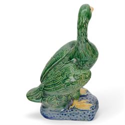 Pair of 20th century Chinese standing ducks, standing on a mottled base, H20cm