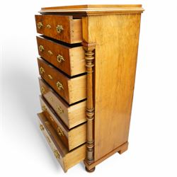 Tall late 19th century walnut chest, stepped and moulded top over six drawers, ornate cast gilt metal handles, enclosed by turned and fluted upright columns, on turned front feet 