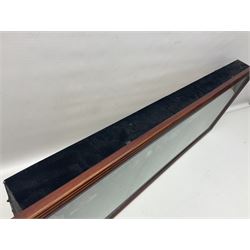 Four framed sporting memorabilia displays, the largest example containing 1930s cricket memorabilia, together with two fishing displays and a football display, each within wooden glazed frames, largest H105cm