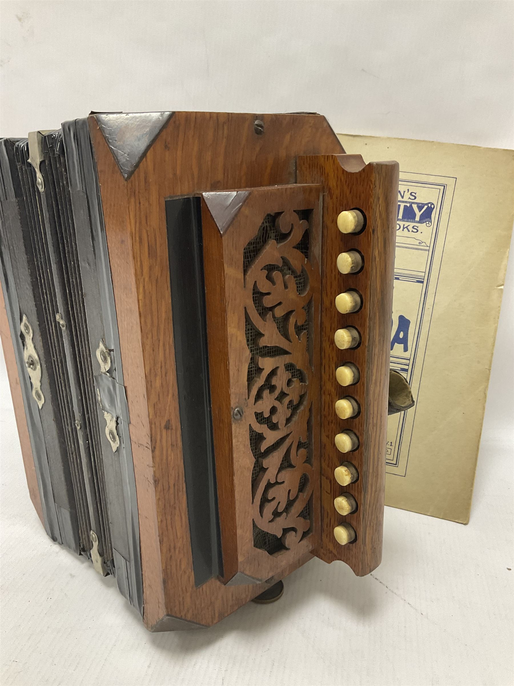 Three European concertinas, comprising Viceroy German concertina with 21 keys, hexagon wooden frame and 8 fold bellows
Oak framed concertina with 12 keys and 8 fold bellows
Commander concertina with 12 keys and 12 fold bellows
With tutor