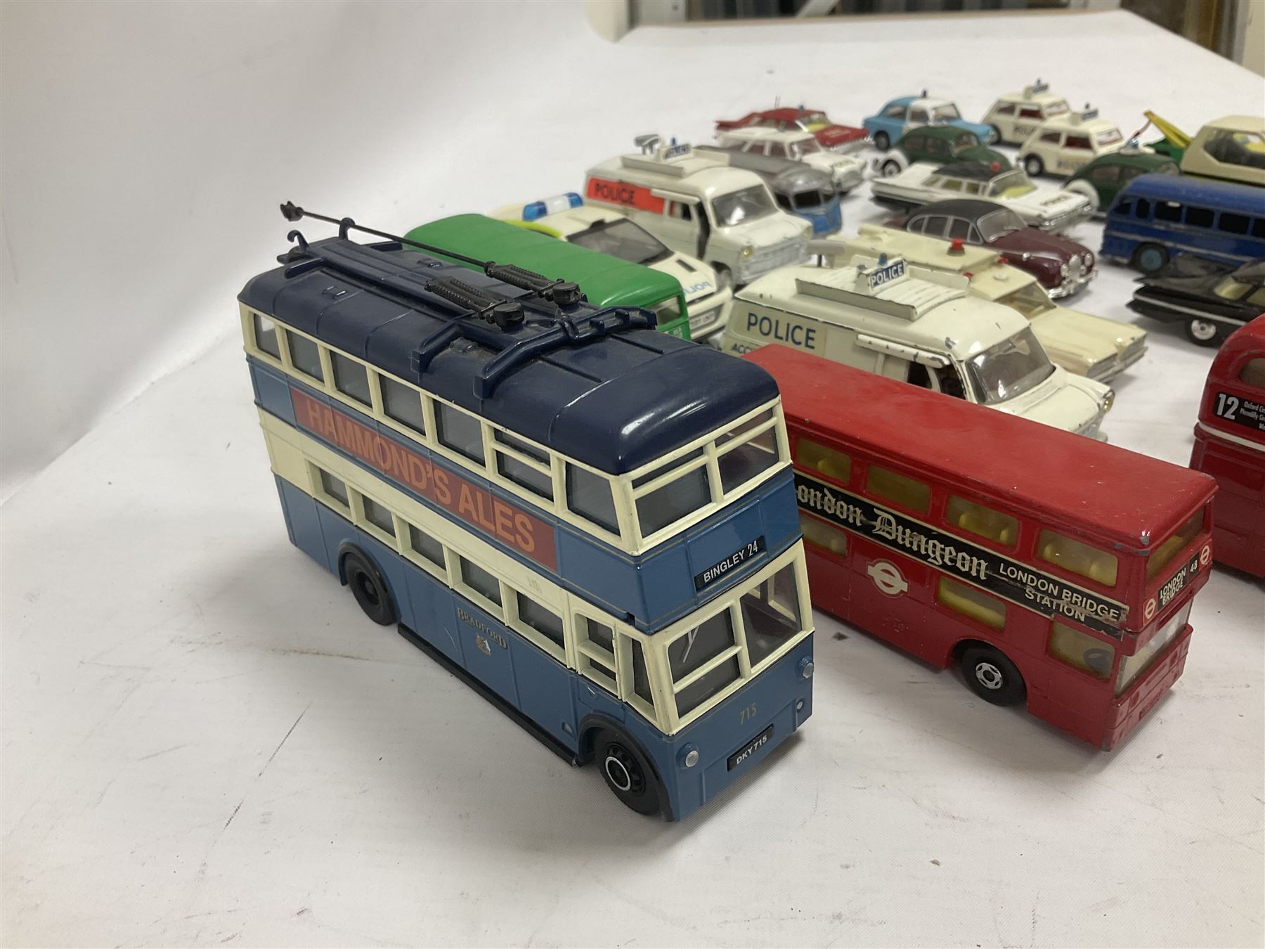 Corgi/Dinky - twenty-four unboxed and playworn die-cast models, predominantly emergency vehicles and buses; including Autocar Isobloc, Superior Criterion Ambulance, Ford Transit Police Vans, Chevrolet Impalas, Minissima, Ausin Mini Police van etc (24)