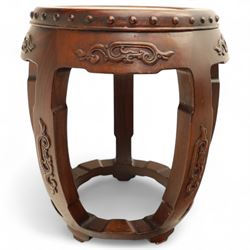 Pair of early 20th century Oriental hardwood barrel seats, of drum form with shaped apron and pierced panels, carved with stylised scrollwork and studded detail to the top