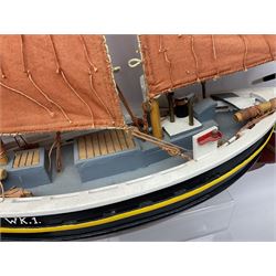 Wooden model of the Peterhead Herring Fishing Boat, Love Divine, PD404. on stand together with Wick Herring Fishing Boat, Galilee WK.1. on stand, L105cm, H64cm