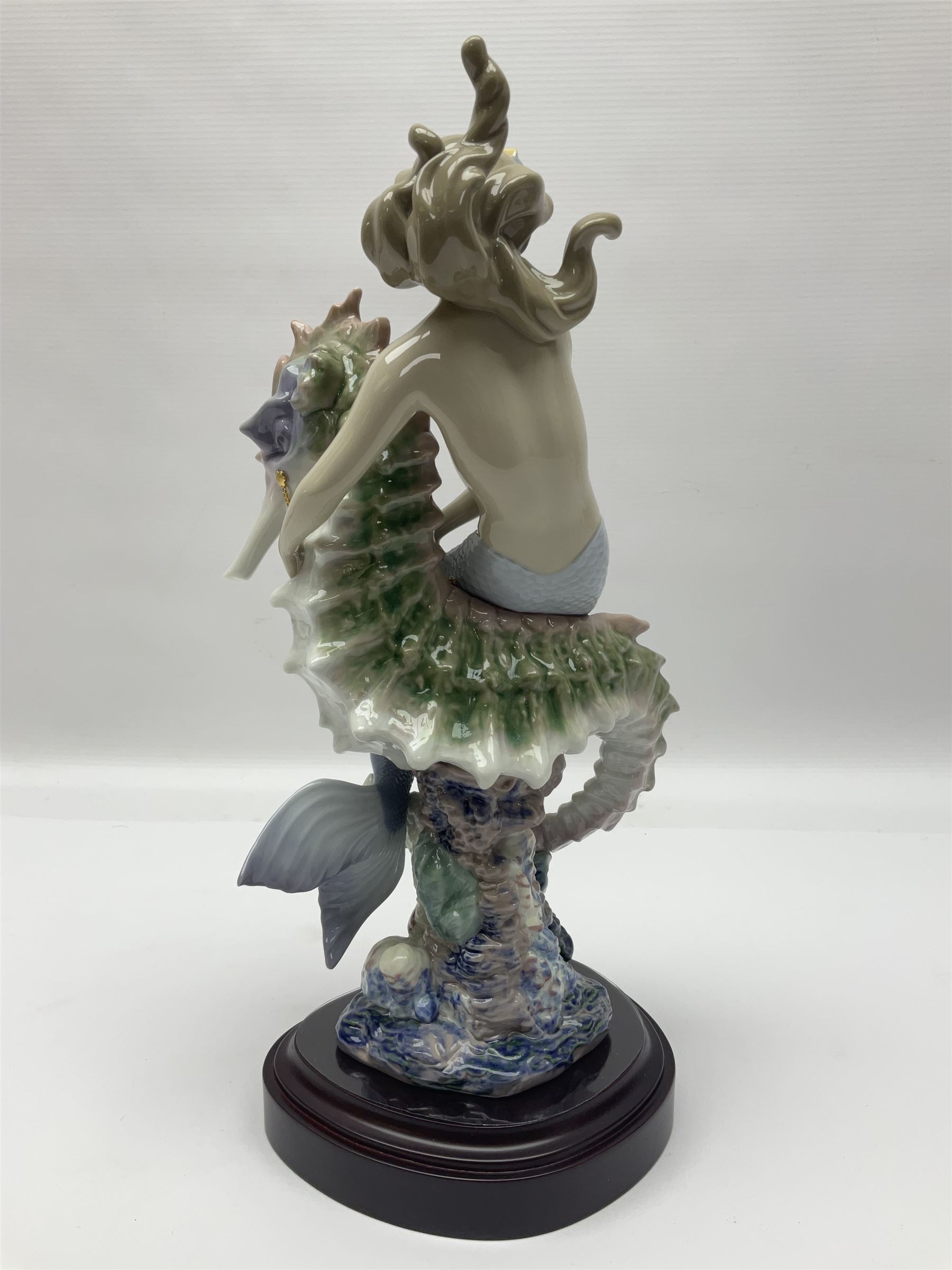 Lladro figure, Beneath the Waves, modelled as a mermaid and seahorse upon a wooden plinth, no 1822, limited edition 1389/2500, with certificate and original box, H32cm 