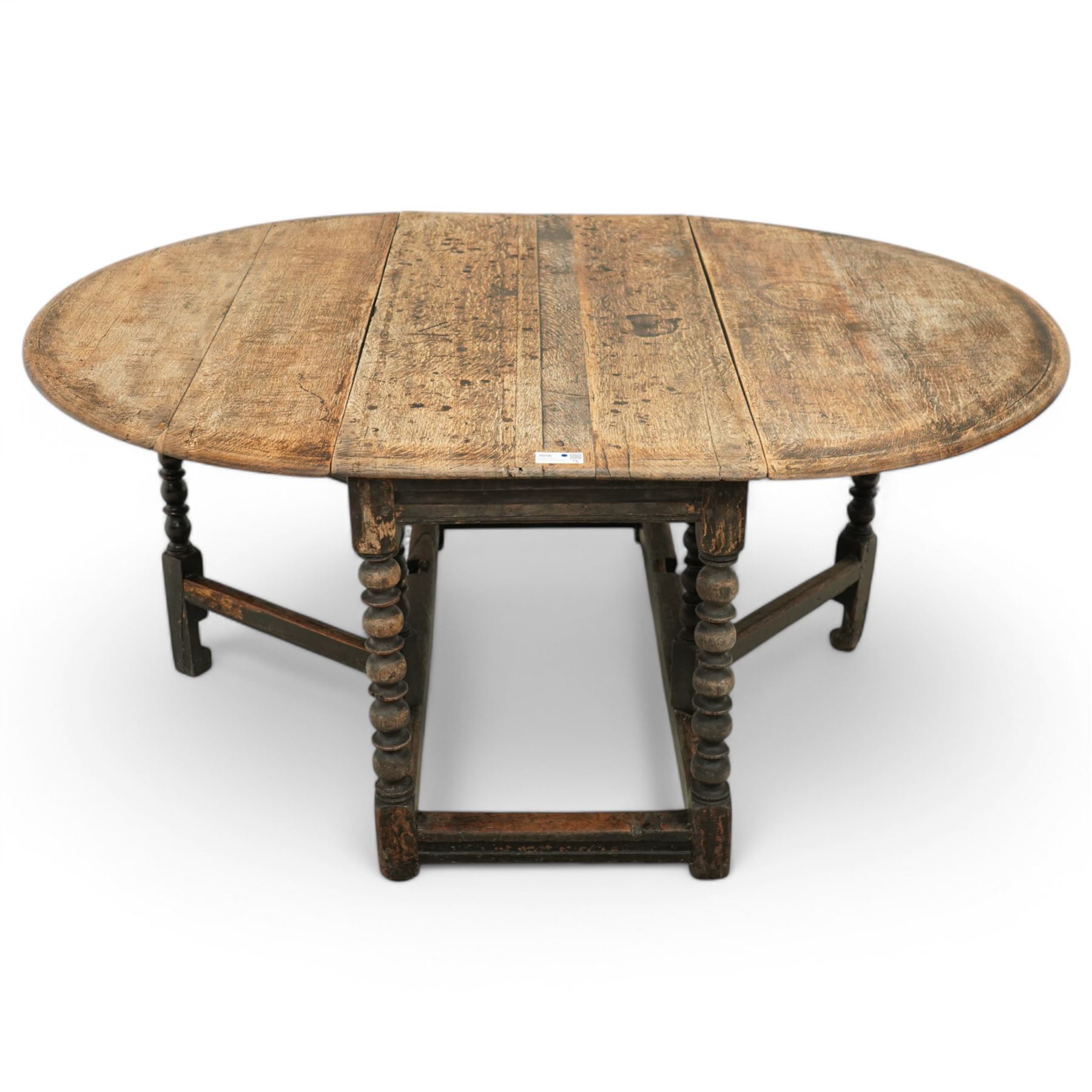 Late 17th century oak drop-leaf dining table, oval drop-leaf top on gate-leg action base, bobbin turned supports untied by moulded stretchers 