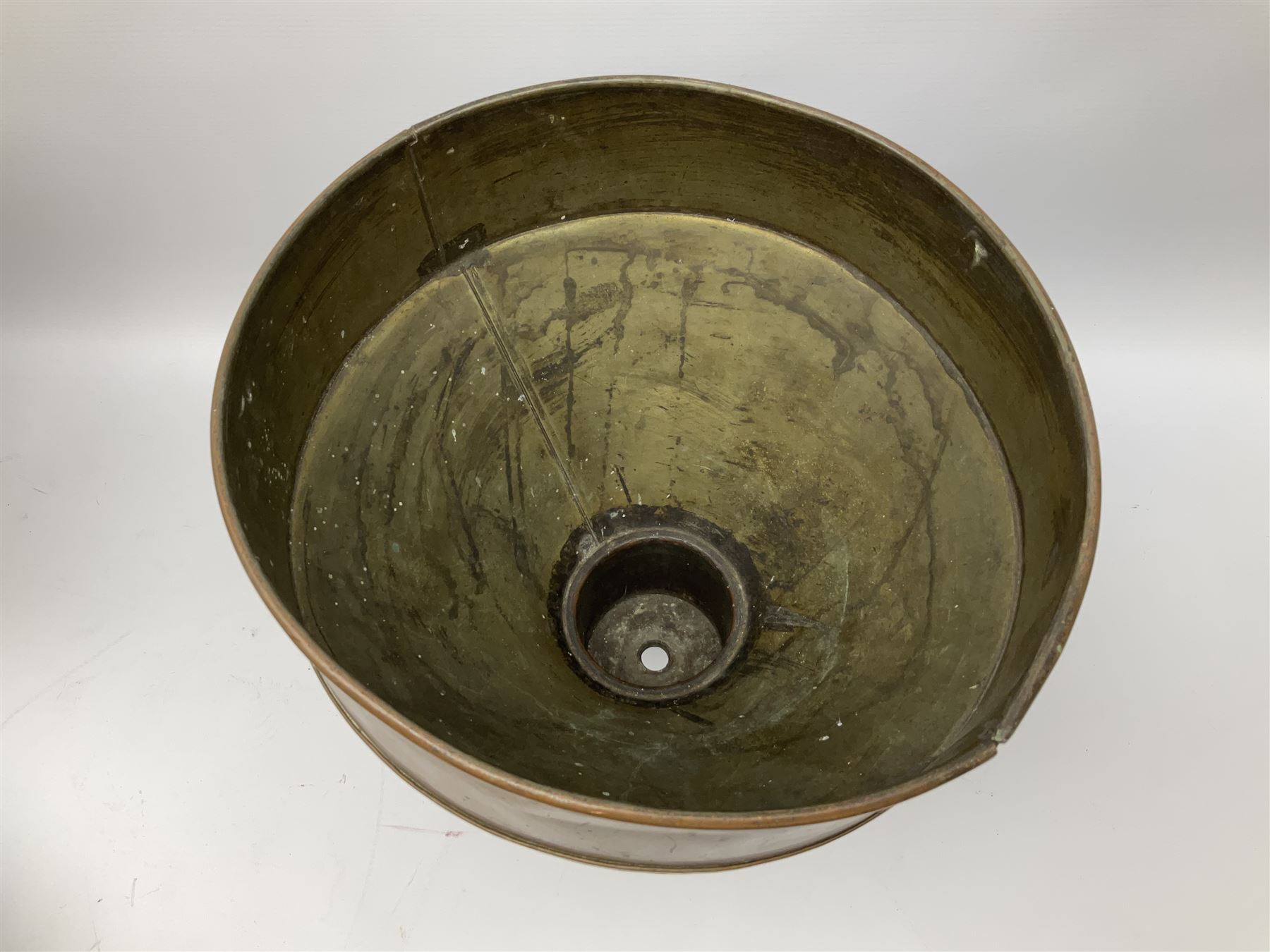 Agricultural copper corn funnel, H32.5cm, another similar copper funnel and copper warming platter of oval form, with twin handles on four supports, with removeable warming plate, L49cm