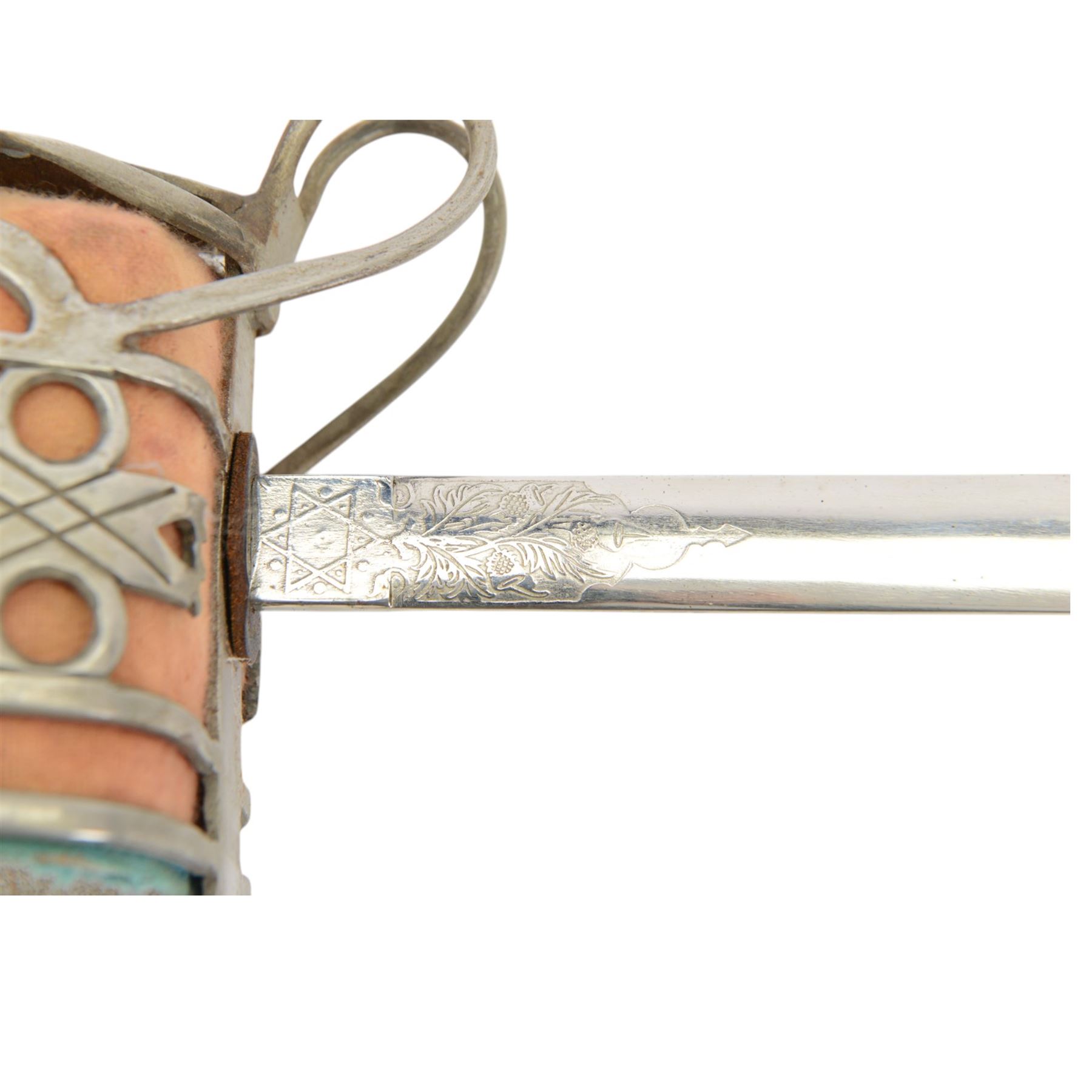 Reproduction Scottish basket infantry sword, 1828 pattern, the L79cm blade, etched with thistles and scroll work, dome pommel with a ball finial, basket hilt with heart piercing, with a steel scabbard, overall L98cm