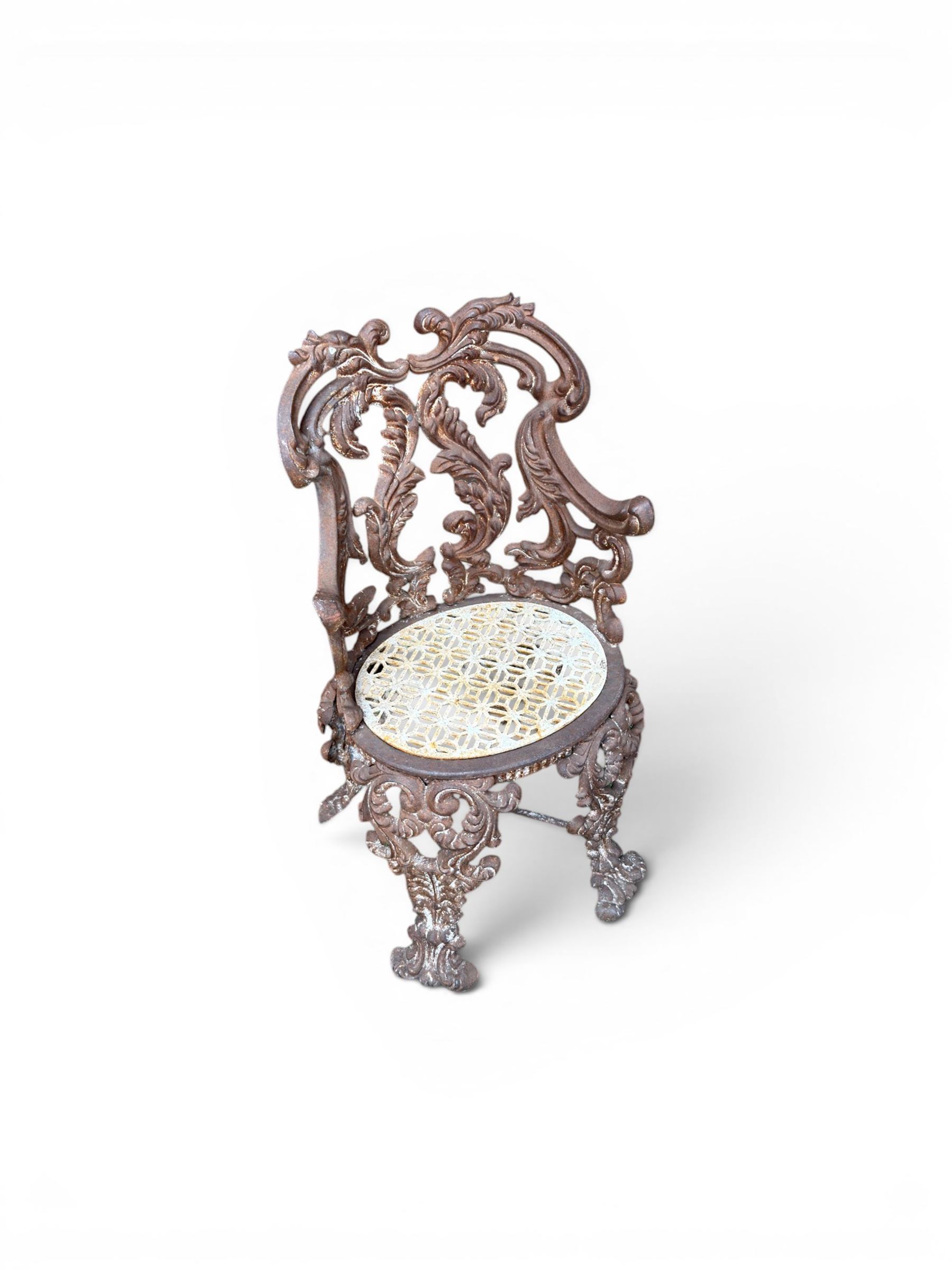19th century Rococo Revival cast iron garden chair, pierced back comprised of scrolling acanthus leaves, over a pierced geometric white painted drop-in seat, raised on four acanthus and anthemion shaped cabriole supports united by X-frame stretcher