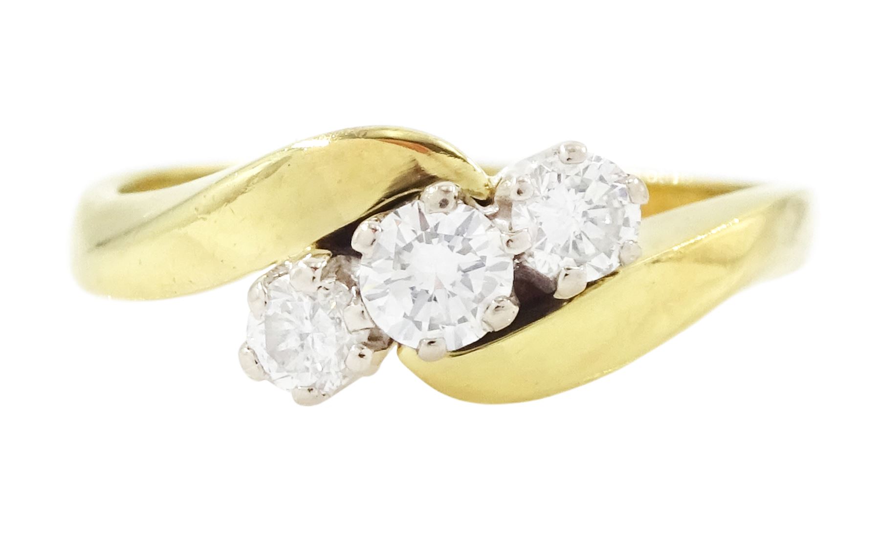18ct gold diamond crossover ring, set three round brilliant cut diamonds, London 1991, total diamond weight 0.35 carat