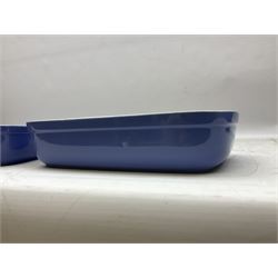 Emile Henry covered casserole dish of oval form in two tone brown and cream, no. 03.06, together with cast iron Nomar twin handled lidded casserole dish of oval form in navy, and other ovenware including Flintware ICTC, largest L35cm