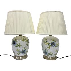 Pair of lamps of baluster form, decorated with passion flowers and humming birds under a crackle glaze, including shade H53cm