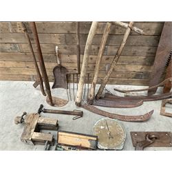 Large quantity of vintage hand tools including scales, scythes, saws etc