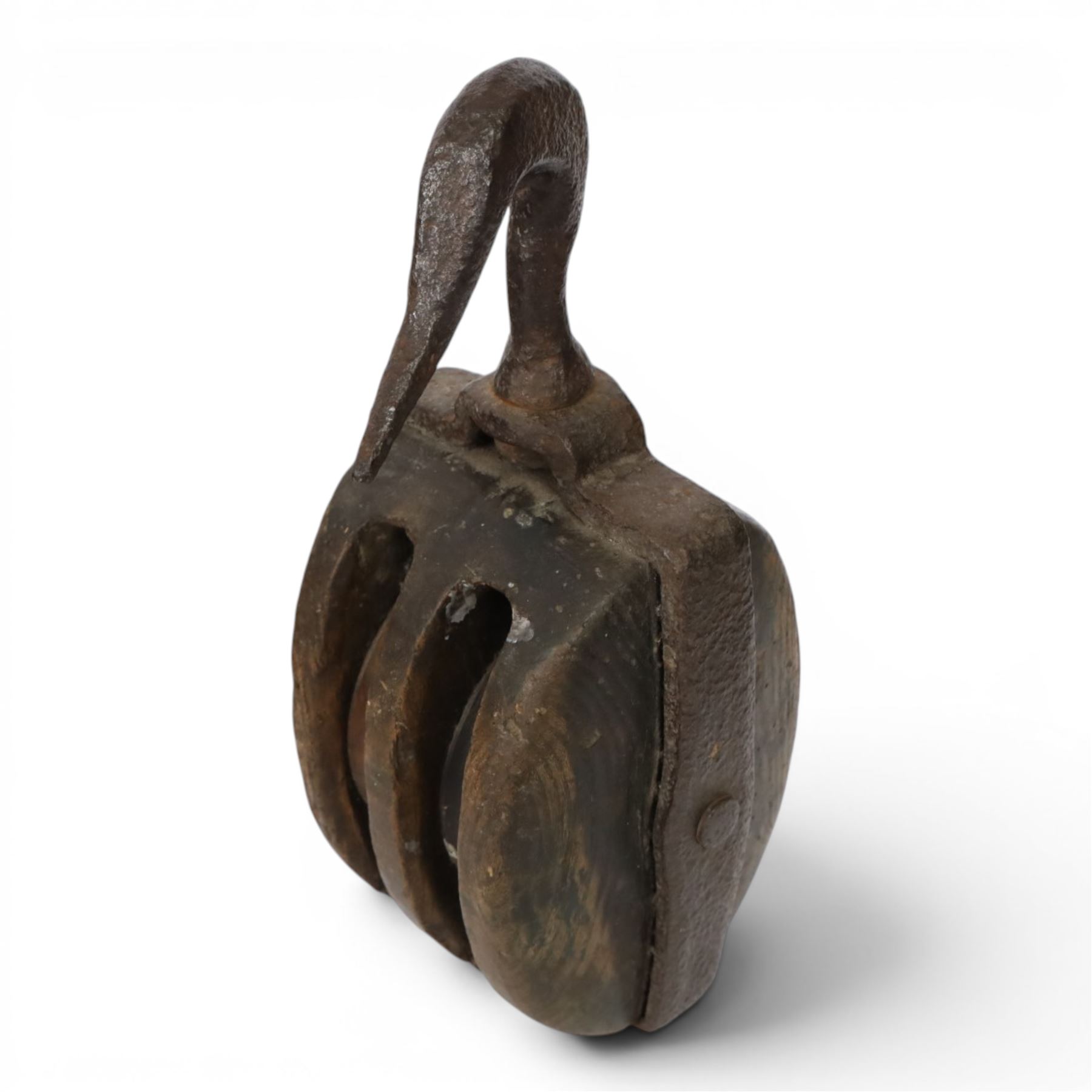 19th century double-sheave wooden pulley block in a metal casing, fitted with an iron hook, stamped GIS to one side, including hook L36cm