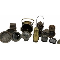 A collection of vintage motorcycle and cycle lamps. 